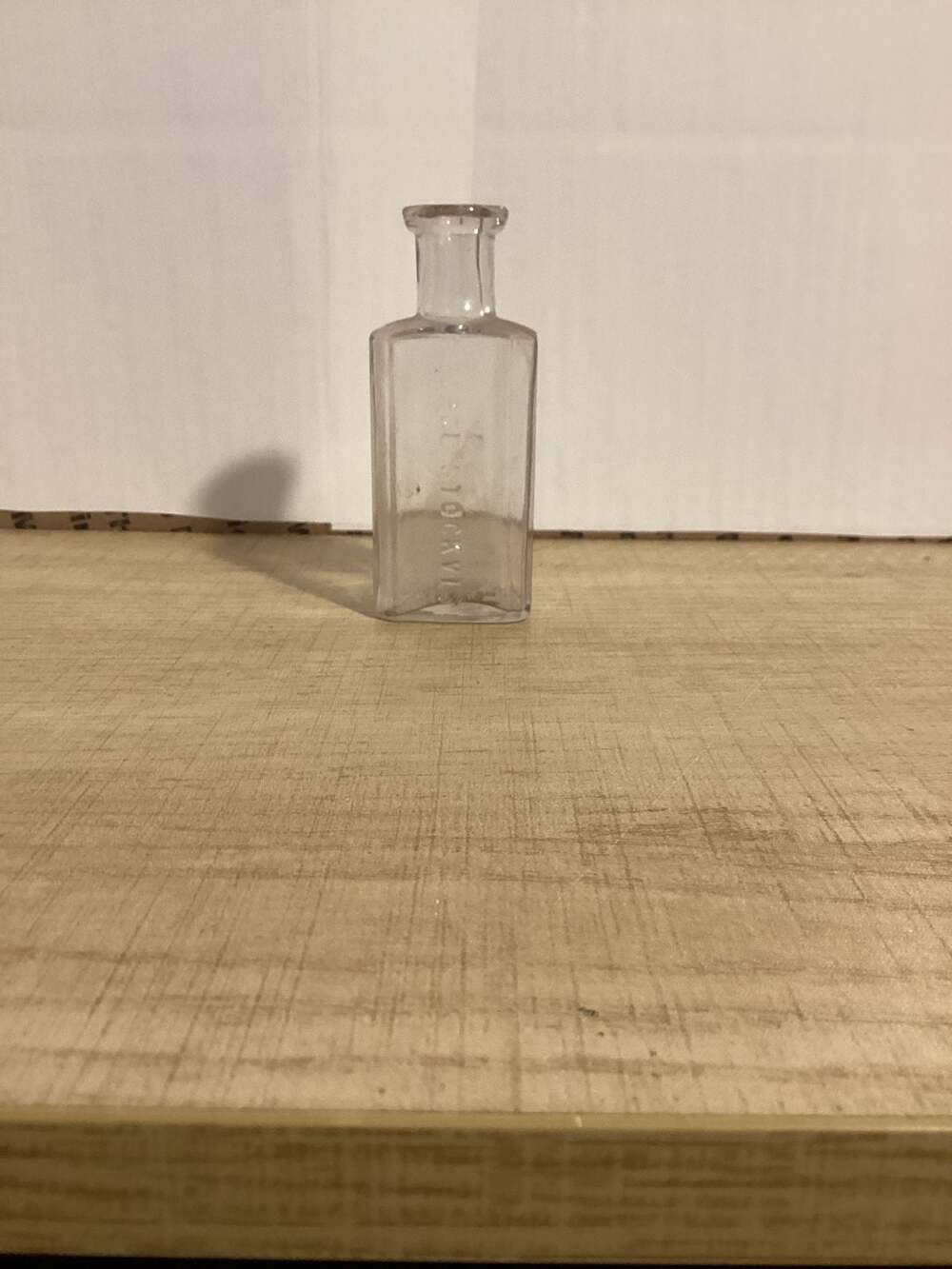 Antique Clear Glass Embossed George Stockvis Medicine Bottle